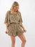 animal print romper on model from front