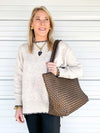 BC Bag woven tote bag in bronze on woman's shoulder