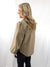 back of tan faux leather top on model