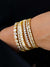 bezel heart tennis bracelet layered with other bracelets