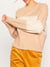cream and beige colorblock sweater on model