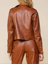 camel vegan leather biker jacket on model from back