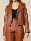 camel vegan leather biker jacket on model closeup
