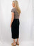 woven black midi skirt on model from back