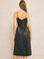 black faux leather midi dress on model from back