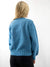 blue sweater on model from back