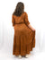 bronze long sleeve maxi on model from back