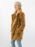 camel faux fur jacket on model from side