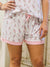 cheers sleep shorts with champagne bottles on model
