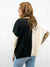 black colorblock sweater on model from back