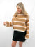 cropped neutral striped sweater on model from front
