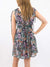 floral ruffle dress on model from back