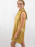 metallic gold ruffle neckline dress on model from side