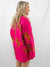 hot pink oversized cardigan from side with orange tiger print