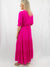 hot pink long maxi dress on model from back