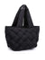 black woven tote sitting