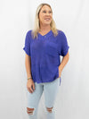 purple knit v-neck top on model from front