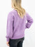 lavender mock neck sweater from back on model
