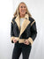 faux suede and leather style jacket with sherpa details on model