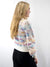 pastel cheetah and floral print sweater on model from side