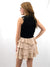 nude ruffle layered skirt on model from back