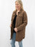 brown thin quilted jacket on model