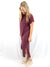 midi t-shirt dress in wine on model from side showing small slit