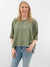 oversized olive mineral wash cropped pullover from front on  model