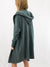 green hooded cardigan on model from back