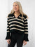 black and cream striped cropped sweater on model