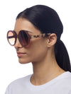 OKKIA Monica Sunglasses in Pink Havana from side on model