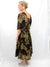 brown leaf print maxi dress on model from back