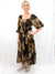 brown leaf print maxi dress on model from front