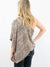 one shoulder taupe top from back