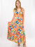 bright palm leaf maxi dress on model from front