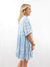 light blue and white shirt dress on model from side