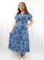 blue and white floral maxi dress with belt on model