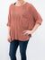 ginger colored knit top on model