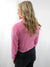 rhinestone pink button up crop top on model from back
