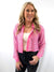 rhinestone pink button up crop top on model from front