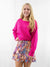 paisley and floral smocked skirt on model with fuchsia sweater