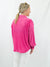 magenta pleated button down on model from back
