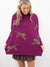 cheetahs running on plum mock neck sweater from front