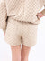 closeup of ivory quilted shorts back