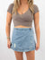 crossover denim mini skirt from very front on model
