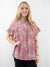 light pink mauve safari pattern blouse on model