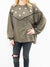 olive green pullover top with sequin stars and fringe