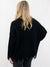 black frayed sweater from back