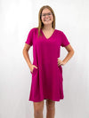 v-neck shift dress in magenta on model from front