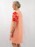 orange embroidered sleeve detail on dress